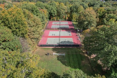 Welcome to 6 Woods Hollow Court, a bright and sunny end unit on Farmington Woods Country Club in Connecticut - for sale on GolfHomes.com, golf home, golf lot