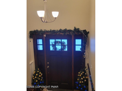 Experience the perfect blend of mountain serenity and modern on Pocono Farms Country Club in Pennsylvania - for sale on GolfHomes.com, golf home, golf lot