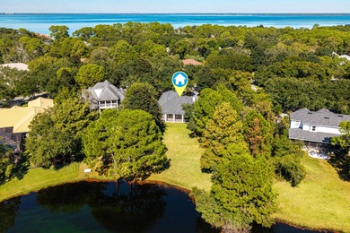 Welcome to 228 Matties Way, an exquisite lakefront retreat that on Kelly Plantation Golf Club in Florida - for sale on GolfHomes.com, golf home, golf lot