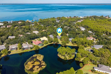 Welcome to 228 Matties Way, an exquisite lakefront retreat that on Kelly Plantation Golf Club in Florida - for sale on GolfHomes.com, golf home, golf lot