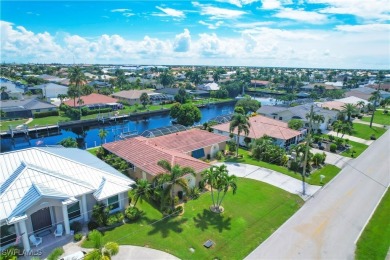 This immaculate waterfront canal pool home with gulf-access is on Saint Andrews South Golf Club in Florida - for sale on GolfHomes.com, golf home, golf lot