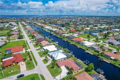 This immaculate waterfront canal pool home with gulf-access is on Saint Andrews South Golf Club in Florida - for sale on GolfHomes.com, golf home, golf lot