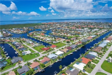 This immaculate waterfront canal pool home with gulf-access is on Saint Andrews South Golf Club in Florida - for sale on GolfHomes.com, golf home, golf lot