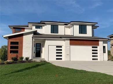 This home has a modern front elevation with stone cedar lap and on Heritage Park Golf Course in Kansas - for sale on GolfHomes.com, golf home, golf lot