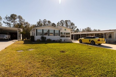 Welcome to this beautifully maintained 1999 Palm Harbor home in on Southern Dunes Golf and Country Club in Florida - for sale on GolfHomes.com, golf home, golf lot