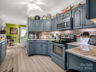 Move-in ready w/many updates, low maintenance yard & seasonal on Rumbling Bald Resort on Lake Lure in North Carolina - for sale on GolfHomes.com, golf home, golf lot