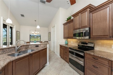 Impressive home with EXPANSIVE VIEWS OF THE GOLF COURSE AND on Saint Andrews South Golf Club in Florida - for sale on GolfHomes.com, golf home, golf lot