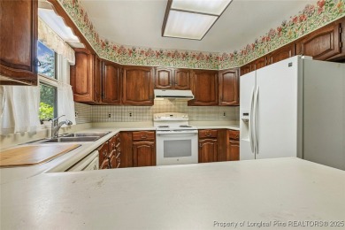 Charming home located in the gated and golf community of on Carolina Trace Country Club in North Carolina - for sale on GolfHomes.com, golf home, golf lot