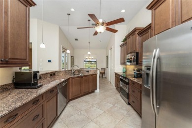 Impressive home with EXPANSIVE VIEWS OF THE GOLF COURSE AND on Saint Andrews South Golf Club in Florida - for sale on GolfHomes.com, golf home, golf lot