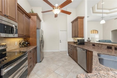 Impressive home with EXPANSIVE VIEWS OF THE GOLF COURSE AND on Saint Andrews South Golf Club in Florida - for sale on GolfHomes.com, golf home, golf lot