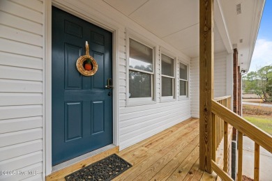 Welcome to 806 Wind Way - a hidden gem nestled in the gated on Harbour Point Golf Club in North Carolina - for sale on GolfHomes.com, golf home, golf lot