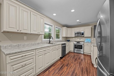 Welcome to 806 Wind Way - a hidden gem nestled in the gated on Harbour Point Golf Club in North Carolina - for sale on GolfHomes.com, golf home, golf lot