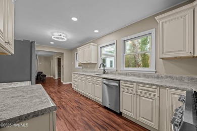 Welcome to 806 Wind Way - a hidden gem nestled in the gated on Harbour Point Golf Club in North Carolina - for sale on GolfHomes.com, golf home, golf lot