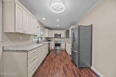 Welcome to 806 Wind Way - a hidden gem nestled in the gated on Harbour Point Golf Club in North Carolina - for sale on GolfHomes.com, golf home, golf lot