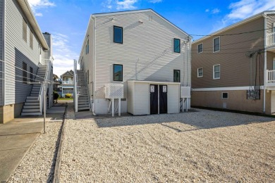 This beautifully renovated 6 bedroom 4 bath modern chic duplex on Ocean City Muni Golf Course in New Jersey - for sale on GolfHomes.com, golf home, golf lot