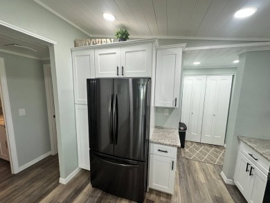 Lot Rent $1037.00 monthly    This beautifully updated home is on Del Tura Golf and Country Club in Florida - for sale on GolfHomes.com, golf home, golf lot