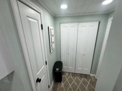 Lot Rent $1037.00 monthly    This beautifully updated home is on Del Tura Golf and Country Club in Florida - for sale on GolfHomes.com, golf home, golf lot
