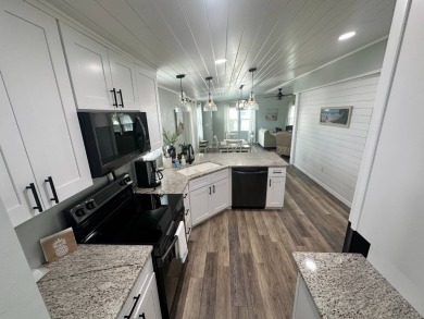 Lot Rent $1037.00 monthly    This beautifully updated home is on Del Tura Golf and Country Club in Florida - for sale on GolfHomes.com, golf home, golf lot