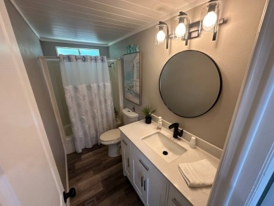 Lot Rent $1037.00 monthly    This beautifully updated home is on Del Tura Golf and Country Club in Florida - for sale on GolfHomes.com, golf home, golf lot