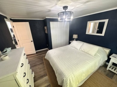Lot Rent $1037.00 monthly    This beautifully updated home is on Del Tura Golf and Country Club in Florida - for sale on GolfHomes.com, golf home, golf lot