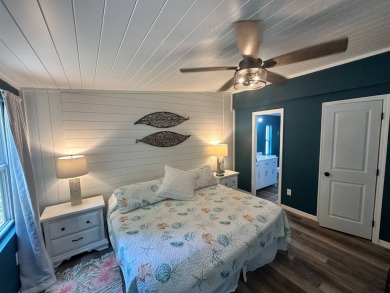 Lot Rent $1037.00 monthly    This beautifully updated home is on Del Tura Golf and Country Club in Florida - for sale on GolfHomes.com, golf home, golf lot