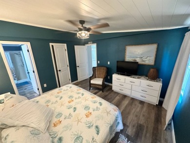 Lot Rent $1037.00 monthly    This beautifully updated home is on Del Tura Golf and Country Club in Florida - for sale on GolfHomes.com, golf home, golf lot