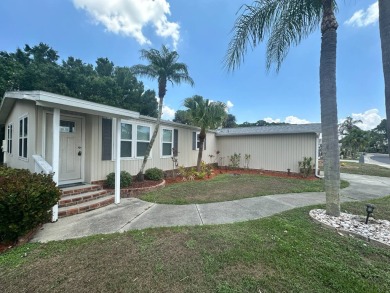 Lot Rent $1037.00 monthly    This beautifully updated home is on Del Tura Golf and Country Club in Florida - for sale on GolfHomes.com, golf home, golf lot