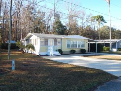 Enjoy living in the quiet, serene 55+ manufactured home on Chiefland Golf and Country Club in Florida - for sale on GolfHomes.com, golf home, golf lot