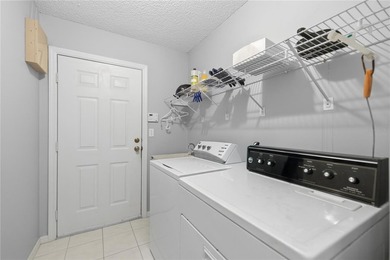 Welcome home to this Holly model 3-bedroom, 2-bath residence in on The Links of Spruce Creek in Florida - for sale on GolfHomes.com, golf home, golf lot