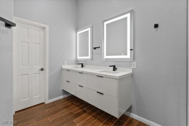 Discover comfortable elegance in the highly sought-after Painted on Painted Desert Golf Club in Nevada - for sale on GolfHomes.com, golf home, golf lot