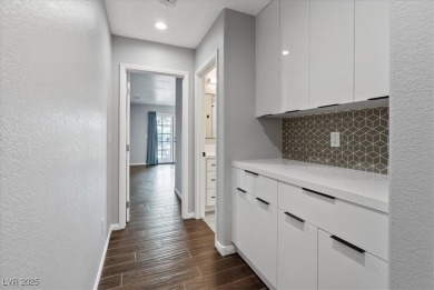 Discover comfortable elegance in the highly sought-after Painted on Painted Desert Golf Club in Nevada - for sale on GolfHomes.com, golf home, golf lot