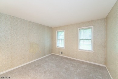 Freshly painted 3-bedroom, den & 3-bath end-unit townhouse on Panther Valley Golf and Country Club in New Jersey - for sale on GolfHomes.com, golf home, golf lot