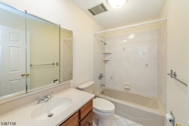 Freshly painted 3-bedroom, den & 3-bath end-unit townhouse on Panther Valley Golf and Country Club in New Jersey - for sale on GolfHomes.com, golf home, golf lot