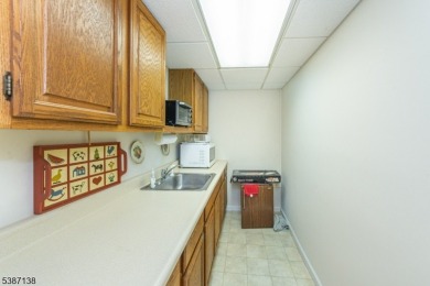 Freshly painted 3-bedroom, den & 3-bath end-unit townhouse on Panther Valley Golf and Country Club in New Jersey - for sale on GolfHomes.com, golf home, golf lot
