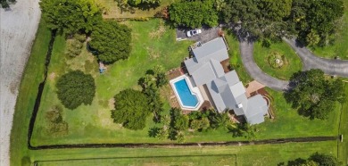 Welcome to one of Palm City's most charming Estate homes located on Martin Downs Country Club in Florida - for sale on GolfHomes.com, golf home, golf lot