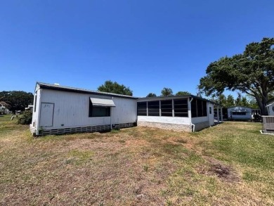 Welcome to your perfect year-round retreat! This charming 2 on Lake Henry Golf Club in Florida - for sale on GolfHomes.com, golf home, golf lot