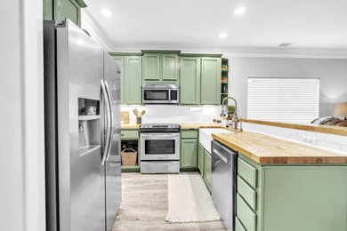 Step inside this beautifully maintained two-story home located on Regatta Bay Golf and Country Club in Florida - for sale on GolfHomes.com, golf home, golf lot