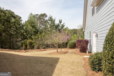 Nestled at the end of a serene cul-de-sac, this charming house on Lanier Island Legacy Golf Couorse in Georgia - for sale on GolfHomes.com, golf home, golf lot