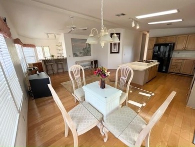 This Casa Grande model home has beautiful golf & water views on Del Tura Golf and Country Club in Florida - for sale on GolfHomes.com, golf home, golf lot