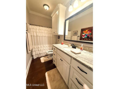 This METICULOUSLY maintained home features a welcoming front on Castlewoods Golf Club in Mississippi - for sale on GolfHomes.com, golf home, golf lot
