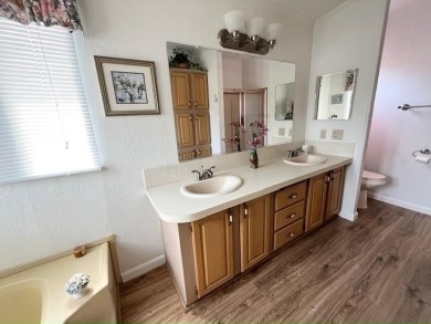 This Casa Grande model home has beautiful golf & water views on Del Tura Golf and Country Club in Florida - for sale on GolfHomes.com, golf home, golf lot