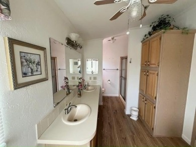 This Casa Grande model home has beautiful golf & water views on Del Tura Golf and Country Club in Florida - for sale on GolfHomes.com, golf home, golf lot