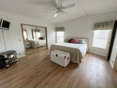 This Casa Grande model home has beautiful golf & water views on Del Tura Golf and Country Club in Florida - for sale on GolfHomes.com, golf home, golf lot