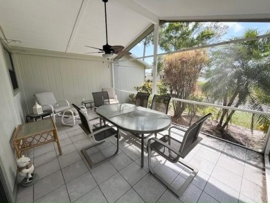 This Casa Grande model home has beautiful golf & water views on Del Tura Golf and Country Club in Florida - for sale on GolfHomes.com, golf home, golf lot
