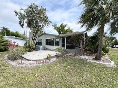 This Casa Grande model home has beautiful golf & water views on Del Tura Golf and Country Club in Florida - for sale on GolfHomes.com, golf home, golf lot