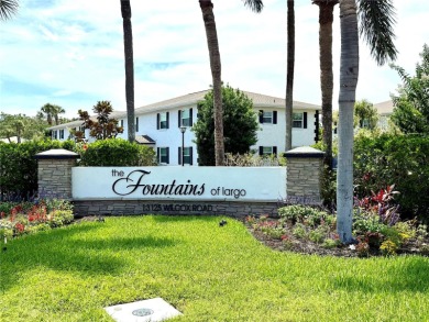Enjoy the Florida lifestyle in this sunny and upgraded condo on Largo Golf Course in Florida - for sale on GolfHomes.com, golf home, golf lot