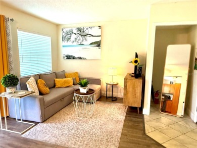 Enjoy the Florida lifestyle in this sunny and upgraded condo on Largo Golf Course in Florida - for sale on GolfHomes.com, golf home, golf lot