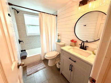 Enjoy the Florida lifestyle in this sunny and upgraded condo on Largo Golf Course in Florida - for sale on GolfHomes.com, golf home, golf lot