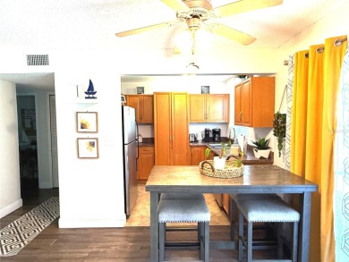 Enjoy the Florida lifestyle in this sunny and upgraded condo on Largo Golf Course in Florida - for sale on GolfHomes.com, golf home, golf lot