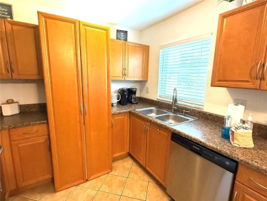 Enjoy the Florida lifestyle in this sunny and upgraded condo on Largo Golf Course in Florida - for sale on GolfHomes.com, golf home, golf lot